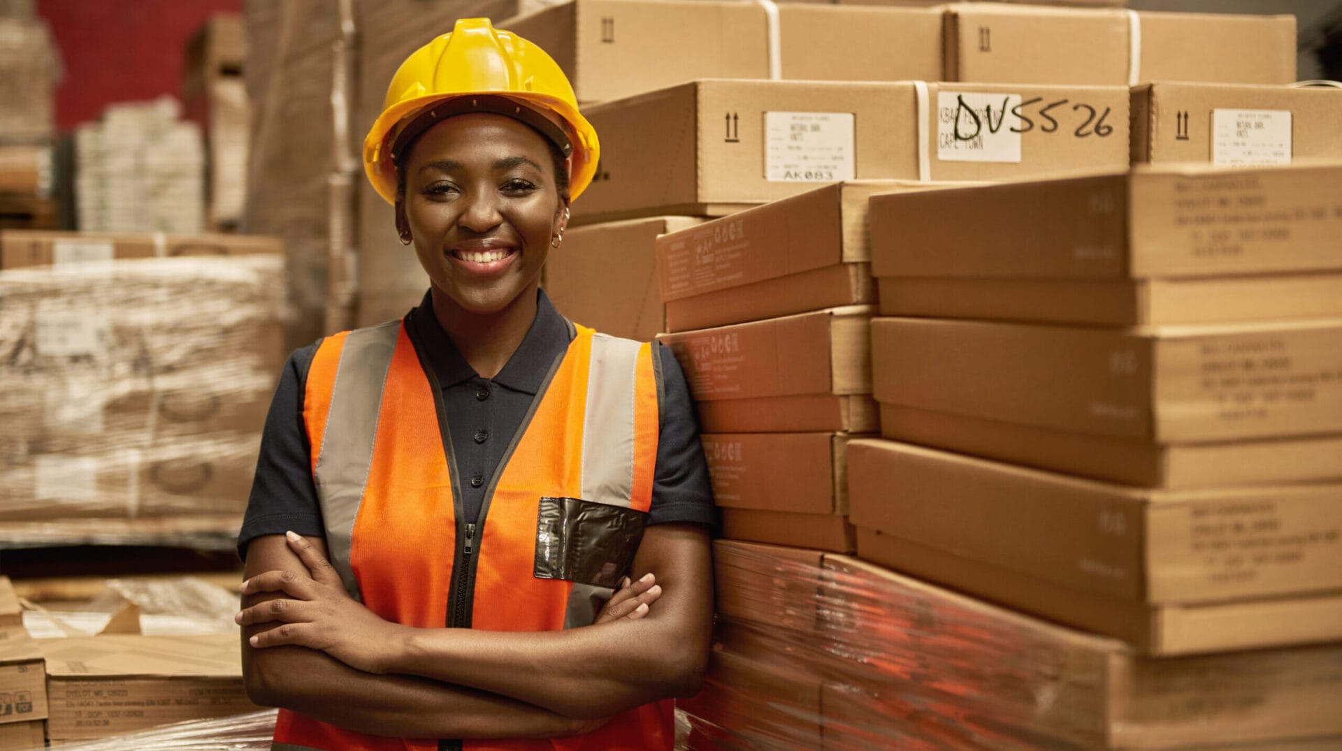 Smiling,Young,African,Female,Warehouse,Worker,Wearing,A,Safety,Vest