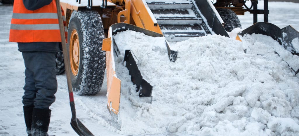 Gig worker removing snow.